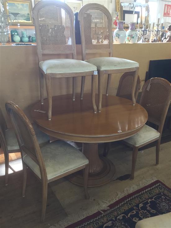 Circular fruitwood extending dining table & six caned back chairs